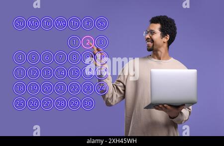 Making timetable. Man with notebook touching virtual calendar on dark violet background Stock Photo