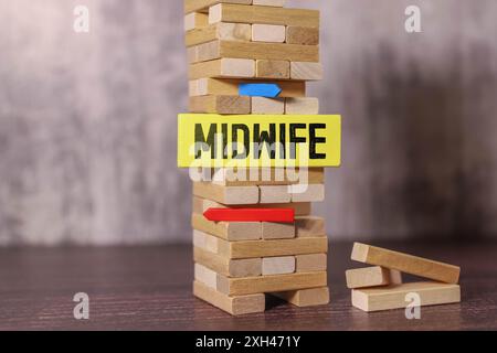 Midwife Word Written In Wooden Cube. Stock Photo