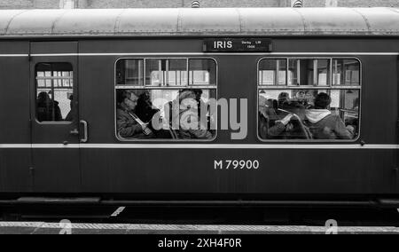 Loughborough (Great Central Railway) passengers on board preserved railcar 79900 Iris during an rail enthusiasts event Stock Photo