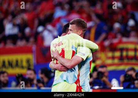 Dani Olmo and Ferran Torres  seen celebrating after goal during UEFA Euro 2024 game between national teams of Albania and Spain at Merkur Spiel-Arena, Stock Photo