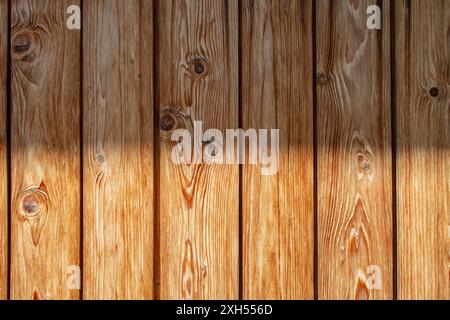 Vertical wooden boards with horizontal half sunlight pattern, abstract wallpaper Stock Photo