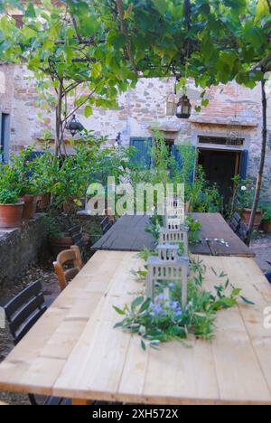 Dining in nature. An outdoor table set up for an organic meal in the evening in Florence, Italy. Stock Photo