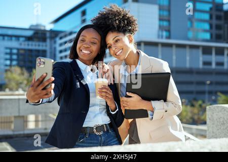 Diverse Urban Business Women Taking Selfie Outdoors with Coffee and Tablet Stock Photo