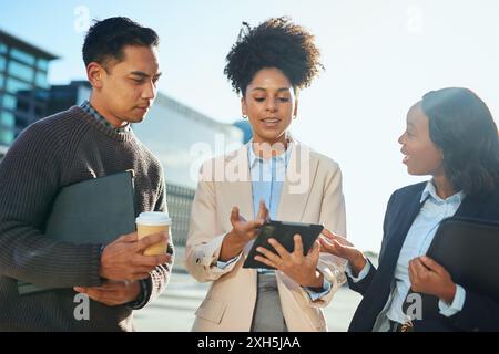 Diverse Group of Urban Business Professionals Discussing Ideas Outdoors Stock Photo