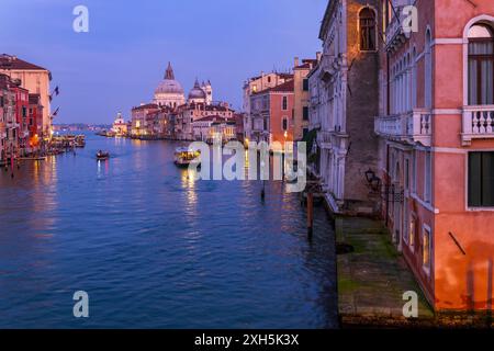 City of Venice in the evening, Italy. The Grand Canal towards the end between San Marco and Dorsoduro districts, view from the side of Accademia Bridg Stock Photo