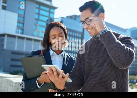 Diverse Business Team Collaborating Outdoors in Urban Setting Stock Photo
