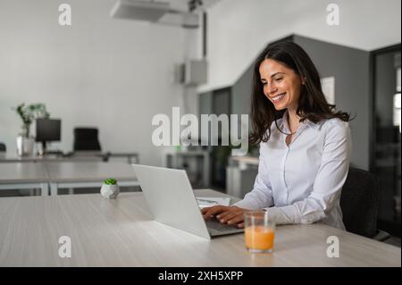 Young woman working in moder coworking space Stock Photo