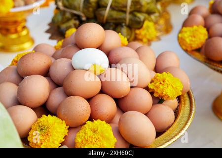 Heap of boiled eggs decoration on plate to pay respect god Stock Photo