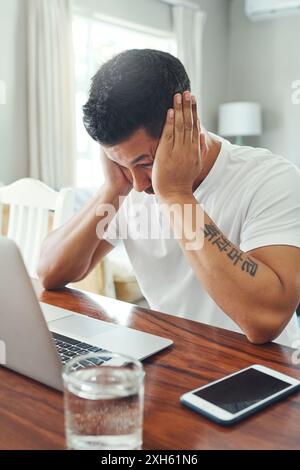 Man, stress and working on laptop with technical glitch, error 404 and software malfunction as employee. Male person, annoyed and upset for deadline Stock Photo