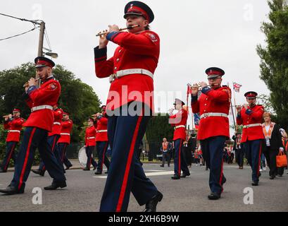 Lurgan, County Armagh, Northern Ireland.12 Jul 2024. The Twelfth of July is marked by Orange Order parades across Northern Ireland. Lurgan District left their headquarters at Brownlow House before parading up the town to the war memorial ahead of the main County Armagh demonstration being held in Killylea this year.The parades across Northern Ireland mark the victory of William of Orange over James at the Battle of the Boyne in 1690. Credit: CAZIMB/Alamy Live News. Stock Photo