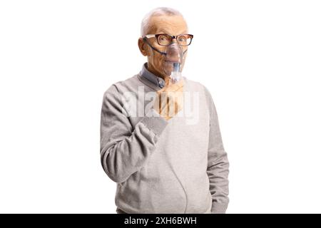 Elderly man using inhaling mask from a nebulizer isolated on white background Stock Photo