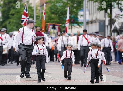 People take part in an Orange Order parade in Portadown, Co Armagh ...