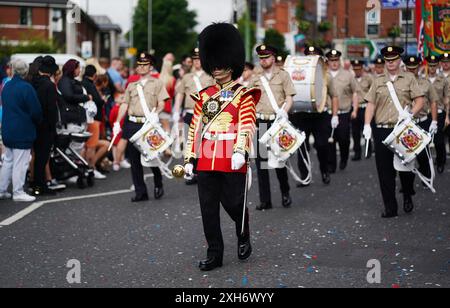 People take part in an Orange Order parade in Portadown, Co Armagh ...