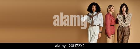 Diverse group of fashionable women stand together, showcasing style and culture on a neutral background. Stock Photo