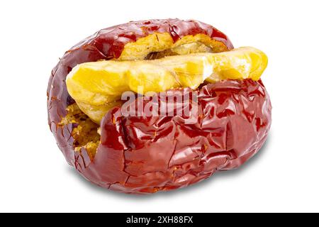 Single dried red chinese jujube stuffed with walnut isolated on white background with clipping path. Stock Photo