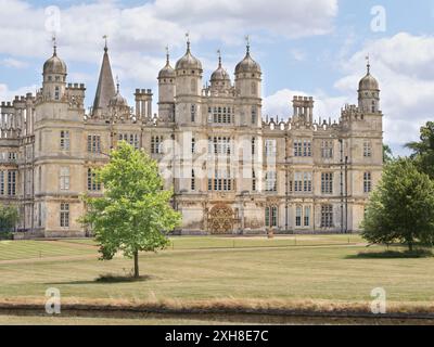 West facade of Burghley House, a sixteenth century mansion built by William Cecil, chief minister to Queen Elizabeth I. Stock Photo