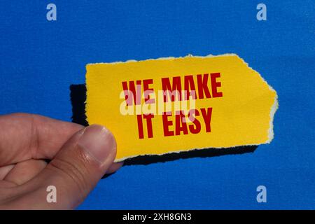 We make it easy message written on ripped white paper piece with yellow ...