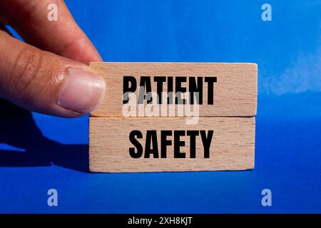 Patient safety message written on ripped cardboard paper pieces with ...