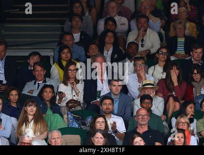 London, UK. 12th July, 2024. 12th July 2024; All England Lawn Tennis and Croquet Club, London, England; Wimbledon Tennis Tournament, Day 12; English television presenter, journalist, and writer Jeremy Clarkson sitting next to girlfriend Lisa Hogan in the stands at Centre Court watching Daniil Medvedev (RUS) vs Carlos Alcaraz (ESP), gentlemens singles semi final match Credit: Action Plus Sports Images/Alamy Live News Stock Photo