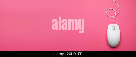 Computer mouse on pink background, top view. Banner design with space for text Stock Photo