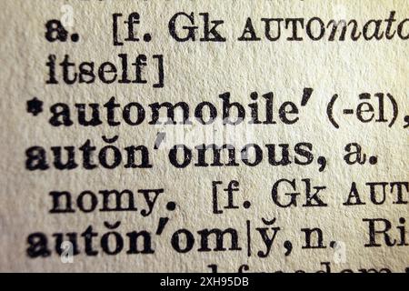 Words automobile and autonomous on dictionary page, macro close-up Stock Photo