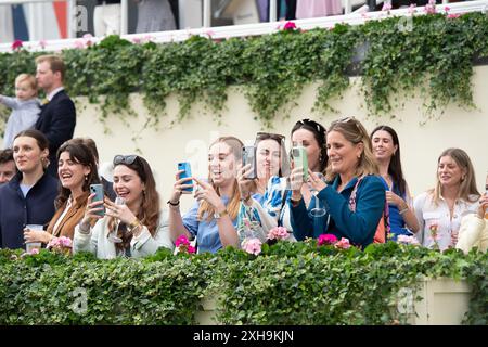 Ascot, Berkshire, UK. 12th July, 2024. Supporters of the jockeys in the Foundation Developments Property Race Day Charity Race at Ascot Racecourse at the Summer Mile Property Raceday. Credit: Maureen McLean/Alamy Live News Stock Photo