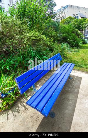 Park bench painted in "International Klein Blue" in the Square Yves Klein, Paris 75014, France. Stock Photo