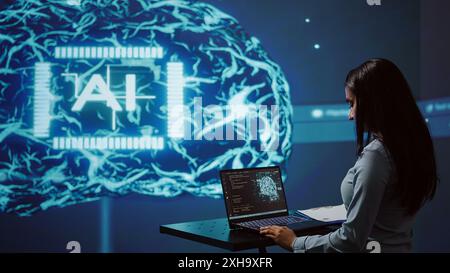 AI specialist reviews data charts, emphasizing importance of data driven decision making in tech industry. Engineer developing innovative artificial intelligence solutions for startup, camera B Stock Photo