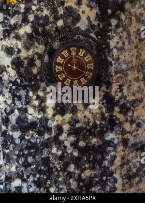 Old wall clock on wall with mold. Stock Photo