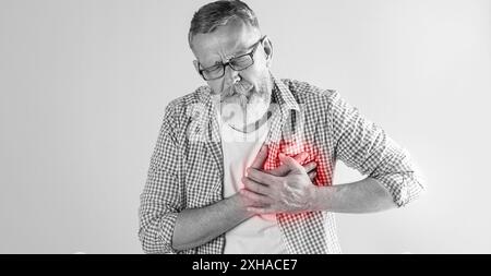 Heart attack. Senior man suffering from severe pain and pressing hands to chest on light background. Banner design Stock Photo