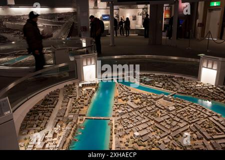 Tourist walk around dioramas of Hiroshima city before and after the bombing in Hiroshima atomic bomb museum, Hiroshima, Japan Stock Photo