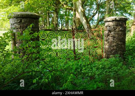 Old wrought iron estate gates at Ballylough House, near Bushmills, County Antrim, Northern Ireland Stock Photo