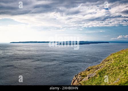 Rathlin Island seen from the cliff top of Fair Head on the north Antrim coast at Ballycastle, N. Ireland Stock Photo