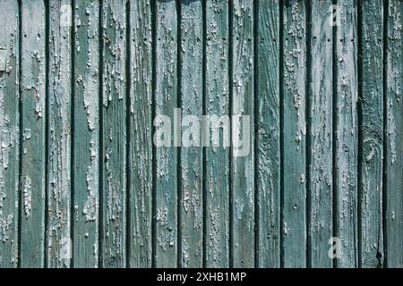 Old weathered green painted wooden wall background texture Stock Photo