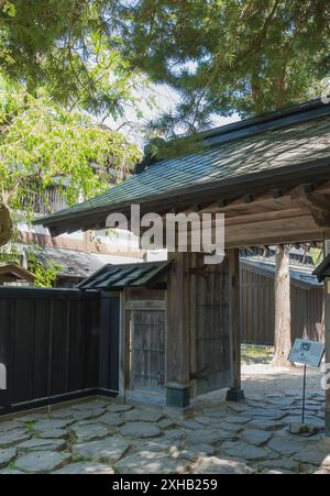 A stroll through Samurai Street in Kakunodate: Embracing the vibrant history and serene beauty of a bright, sunny spring day amidst cherry blossoms an Stock Photo