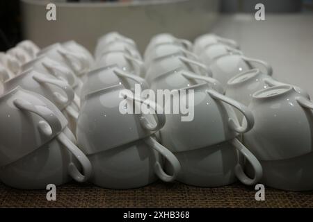 Ceramic cups for tea or coffee on a jute background Stock Photo