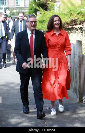 Keir Starmer, leader of the Labour Party and his wife Victoria Starmer arrive to cast their votes in the general election in London, England. Stock Photo