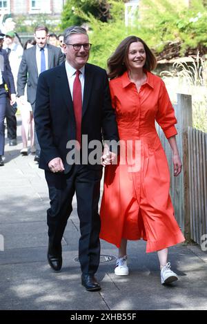 Keir Starmer, leader of the Labour Party and his wife Victoria Starmer arrive to cast their votes in the general election in London, England. Stock Photo