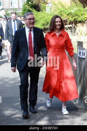 Keir Starmer, leader of the Labour Party and his wife Victoria Starmer arrive to cast their votes in the general election in London, England. Stock Photo