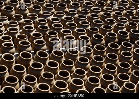 A potter crafts earthenware pottery on clay in Pune, India. Stock Photo