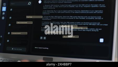 Typing on laptop, person interacting with AI chatbot for customer support. Technology, customer service, interaction, communication Stock Photo