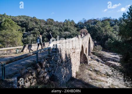 Pedret Bridge, with people walking, Berga, Catalonia, Spain Stock Photo