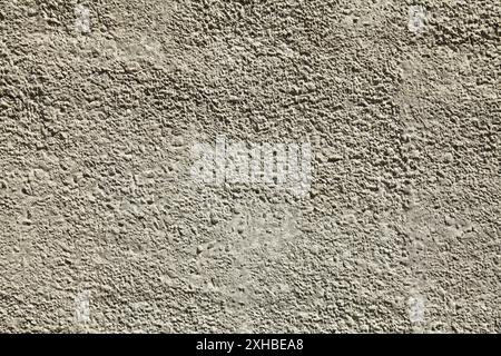 Gray concrete wall, background. The texture of the old wall with plaster and gray whitewash with water-based paint. Unsmooth but flat surface in light Stock Photo