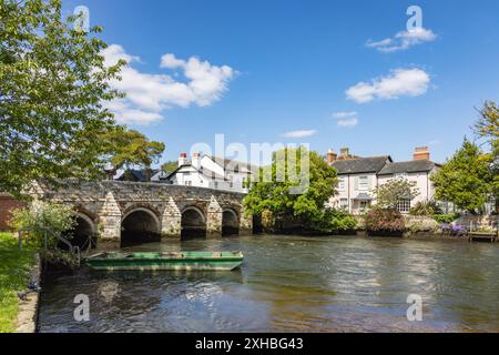 Stone bridge spanning the River Avon in Christchurch, Dorset, England, uk Stock Photo