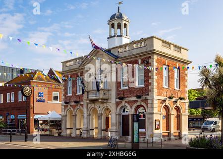 The old Town Hall and clock on the High Street in Christchurch, Dorset, UK Stock Photo