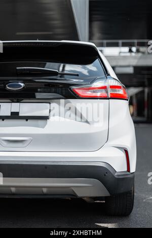 Beautiful modern SUV car in the city. Rear of the car Stock Photo