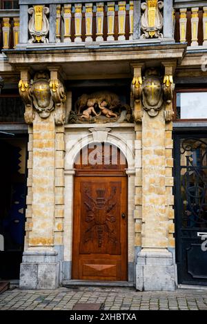 La Louve or Den Wolf on Grand Place in Brussels, Belgium and a relief of Romulus and Remus being suckled by a she-wolf. Stock Photo