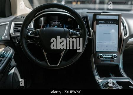 Interior of a modern car with steering wheel, control buttons and display Stock Photo