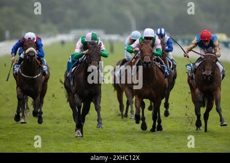 York. United Kingdom. Saturday 13th July 2024. Starlust wins the John Smith's City Walls Stakes under jockey Hector Crouch for trainer Ralph Beckett and owner Mrs Fitri Hay. Credit JTW Equine Images / Alamy Live News Stock Photo