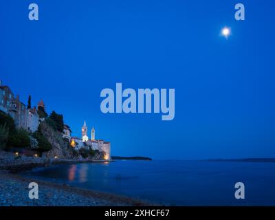 Blue hour and full moon on a beach at island rab in croatia Stock Photo